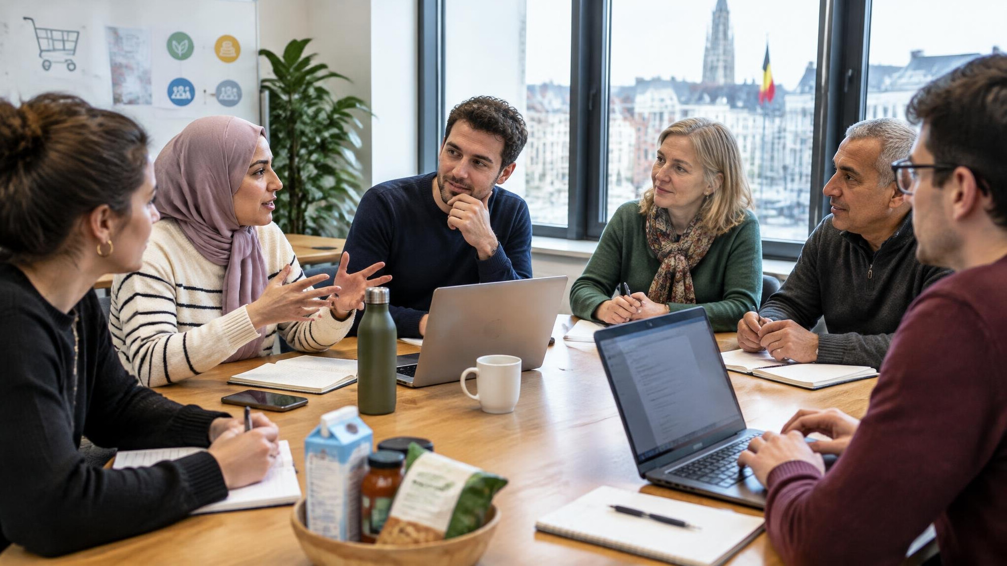 People discussing around a table in a bright meeting room